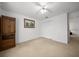 Spacious bedroom with carpet flooring, ceiling fan and view to closet space at 15776 Sw 11Th Terrace Rd, Ocala, FL 34473