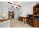 Well-lit bedroom with carpet, ceiling fan and view into other rooms at 15776 Sw 11Th Terrace Rd, Ocala, FL 34473