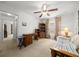 Cozy bedroom featuring carpet flooring, ceiling fan, and ample natural light at 15776 Sw 11Th Terrace Rd, Ocala, FL 34473