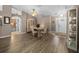 The dining room features hardwood floors, a ceiling fan, and an entry to other rooms at 15776 Sw 11Th Terrace Rd, Ocala, FL 34473