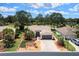 Beautiful home with a well-manicured lawn and landscaping and a brick driveway at 15776 Sw 11Th Terrace Rd, Ocala, FL 34473