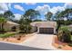Inviting home with manicured landscaping, a brick driveway, and a classic American flag at 15776 Sw 11Th Terrace Rd, Ocala, FL 34473