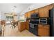 Bright kitchen featuring stainless steel appliances and a dining area with natural light at 15776 Sw 11Th Terrace Rd, Ocala, FL 34473