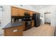 Traditional kitchen with wood cabinets, dark countertops and backsplash, and stainless steel appliances at 15776 Sw 11Th Terrace Rd, Ocala, FL 34473