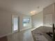 Well-lit dining area with a view of the backyard at 180 Willow Rd, Ocala, FL 34472