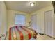 Modest bedroom with tile floors, minimal furniture, and a window at 2508 India Palm Dr, Edgewater, FL 32141