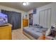 Functional bedroom featuring a dresser, open closet, tile flooring, and comfortable bed at 2508 India Palm Dr, Edgewater, FL 32141