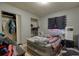 Basic bedroom with an air mattress, closet space, and tile flooring offering comfortable accommodation at 2508 India Palm Dr, Edgewater, FL 32141