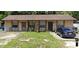 Modest multi-Gathering house with beige painted exterior and straightforward landscaping at 2508 India Palm Dr, Edgewater, FL 32141