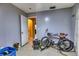 Functional garage space with tile floors, storage, and access to another room at 2508 India Palm Dr, Edgewater, FL 32141