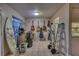 Eclectic living space with guitars, surfboard, tile floors and access to kitchen at 2508 India Palm Dr, Edgewater, FL 32141