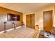 Cozy living room with tile floors, built-in media center, and a leather couch at 2508 India Palm Dr, Edgewater, FL 32141