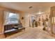 Eclectic living space with guitars, surfboard, tile floors, and leather couch at 2508 India Palm Dr, Edgewater, FL 32141
