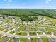 A neighborhood with well-maintained lawns and mature trees provides a peaceful suburban setting at 2984 Ne 43Rd Rd, Ocala, FL 34470
