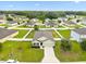 An aerial view captures this lovely home nestled in a serene neighborhood with green landscaping at 2984 Ne 43Rd Rd, Ocala, FL 34470