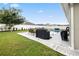 Spacious backyard featuring a well-maintained lawn, privacy fence, and pool area at 2984 Ne 43Rd Rd, Ocala, FL 34470