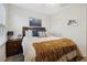 Well-lit bedroom featuring a neatly made bed and neutral decor at 2984 Ne 43Rd Rd, Ocala, FL 34470