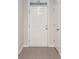 Bright entryway with tile flooring and a view of an interior door at 2984 Ne 43Rd Rd, Ocala, FL 34470