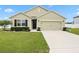Charming single-story home with a well-manicured lawn, inviting entrance, and two car garage at 2984 Ne 43Rd Rd, Ocala, FL 34470