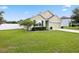 A charming, single-story home featuring a well-manicured lawn and tidy landscaping at 2984 Ne 43Rd Rd, Ocala, FL 34470
