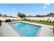 The backyard features a refreshing pool, perfect for enjoying sunny days in this fenced backyard at 2984 Ne 43Rd Rd, Ocala, FL 34470