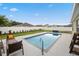Beautiful backyard oasis with a sparkling pool, comfortable seating, and privacy fence at 2984 Ne 43Rd Rd, Ocala, FL 34470