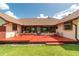Spacious backyard deck featuring outdoor seating with an expansive backyard and lush green lawn at 3555 Sw 24Th Avenue Rd, Ocala, FL 34471