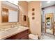Bathroom featuring an updated vanity and a glass shower with a beige and white design at 3555 Sw 24Th Avenue Rd, Ocala, FL 34471