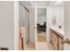 Bathroom featuring an updated vanity and a glass shower with a beige and white design at 3555 Sw 24Th Avenue Rd, Ocala, FL 34471