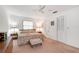 Bright bedroom featuring soft lighting, a ceiling fan, and a cushioned bench at 3555 Sw 24Th Avenue Rd, Ocala, FL 34471