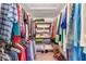 Walk-in closet with clothing racks and shoe shelves for optimal storage at 3555 Sw 24Th Avenue Rd, Ocala, FL 34471