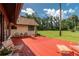 Relaxing outdoor area with a spacious wooden deck and comfortable seating, great for enjoying the lush backyard views at 3555 Sw 24Th Avenue Rd, Ocala, FL 34471