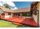 Expansive wooden deck with outdoor seating, perfect for entertaining or relaxing outdoors with beautiful home and backyard views at 3555 Sw 24Th Avenue Rd, Ocala, FL 34471