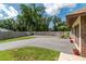 Long driveway with ample parking space and a well-maintained yard featuring a beautiful garage at 3555 Sw 24Th Avenue Rd, Ocala, FL 34471