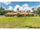 Beautiful brick home with sprawling green lawn and mature trees at 3555 Sw 24Th Avenue Rd, Ocala, FL 34471