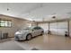 A well-maintained two car garage featuring epoxy floors and bright lighting at 3555 Sw 24Th Avenue Rd, Ocala, FL 34471