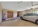 Spacious garage with a beige floor and plenty of room for vehicles and storage at 3555 Sw 24Th Avenue Rd, Ocala, FL 34471