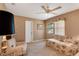 Cozy living room with a window that fills the space with natural light and comfy furniture at 3555 Sw 24Th Avenue Rd, Ocala, FL 34471