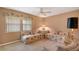 Cozy living room with a window that fills the space with natural light and comfy furniture at 3555 Sw 24Th Avenue Rd, Ocala, FL 34471