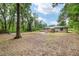 Large backyard with patio and deck offering ample space for recreation and outdoor enjoyment at 3640 Se 131St Ln, Belleview, FL 34420