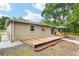 Inviting backyard with a spacious wooden deck and patio area perfect for outdoor entertaining at 3640 Se 131St Ln, Belleview, FL 34420