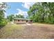 Sprawling backyard featuring a deck and firepit, perfect for outdoor living and entertainment at 3640 Se 131St Ln, Belleview, FL 34420