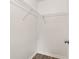 Walk-in closet with wire shelving and wood-look flooring at 3640 Se 131St Ln, Belleview, FL 34420