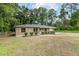 Charming home exterior with well-kept landscaping, decorative shutters, and a freshly mowed lawn at 3640 Se 131St Ln, Belleview, FL 34420