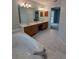 Bright bathroom featuring double vanity, a garden tub, and ensuite bedroom access at 3650 Se 55Th Ct, Ocala, FL 34480