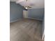 Carpeted bedroom with standard ceiling fan and ensuite bathroom access at 3650 Se 55Th Ct, Ocala, FL 34480