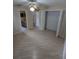 Bedroom features neutral walls, updated flooring, a standard closet and direct access to a bathroom at 3650 Se 55Th Ct, Ocala, FL 34480