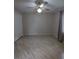 Bedroom features neutral walls, updated flooring, standard closet, and window with curtains at 3650 Se 55Th Ct, Ocala, FL 34480