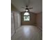 Bedroom with laminate flooring, closet, and a large window at 3650 Se 55Th Ct, Ocala, FL 34480
