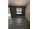 Cozy dining area with tile flooring and a view of the backyard pool through a window at 3650 Se 55Th Ct, Ocala, FL 34480